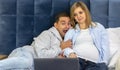 Scared man, pregnant woman using, watching Royalty Free Stock Photo