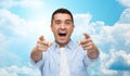 Scared man shouting and pointing finger on you Royalty Free Stock Photo