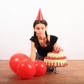 Scared nasty girl picking rose from anniversary cake