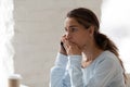 Scared shocked woman talking on phone, receiving bad news