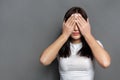 Scared woman covering eyes with hands, see no evil Royalty Free Stock Photo