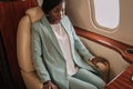 Scared, worried african american businesswoman sitting