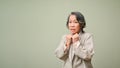 Scared and worried 60s aged asian woman isolated background. Fear, afraid, facial expression