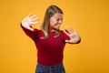 Scared young blonde woman girl in casual clothes posing isolated on yellow orange background studio portrait. People Royalty Free Stock Photo