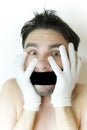 Scared young man with a bandage on a mouth Royalty Free Stock Photo