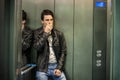 Scared young man desperate in stuck elevator Royalty Free Stock Photo