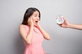 Scared young woman looking at camera over white background Royalty Free Stock Photo