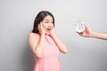 Scared young woman looking at camera over white background Royalty Free Stock Photo