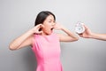 Scared young woman looking at camera over white background Royalty Free Stock Photo