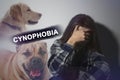 Scared young woman suffering from cynophobia on background. Irrational fear of dogs