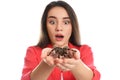 Scared young woman with tarantula on background. Arachnophobia fear of spiders Royalty Free Stock Photo
