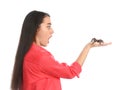 Scared young woman with tarantula on background. Arachnophobia fear of spiders Royalty Free Stock Photo