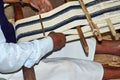 Scarf being woven on a hand loom