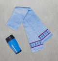 Scarf with printed texture of snowflakes and wool threads. Blue aluminum thermo mug.