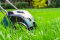 Scarifier on green grass. Work in the garden. Royalty Free Stock Photo