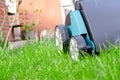 Scarifier on green grass. Work in the garden. Royalty Free Stock Photo