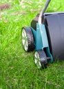 Scarifier on green grass. Work in the garden. scarifier Royalty Free Stock Photo