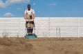 Scarifying lawn with scarifier, Man gardener scarifies the lawn and removal of old grass