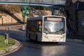 Scarlet Band bus in service for public transport on the road. Single Decker in white Livery