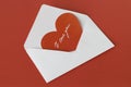 Scarlet heart in a white envelope