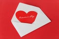 Scarlet heart in a white envelope