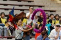 A scarlet macaw flies through a hoop Royalty Free Stock Photo