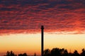 Black pipe in red sky