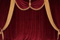 Scarlet velvet curtains with lambrequin and gold fringe Royalty Free Stock Photo