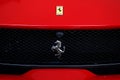 Scarperia Florence, Italy - March 2018 : Detail of Ferrari Logo on Sport Car in the paddock of Mugello Circuit. Royalty Free Stock Photo