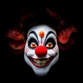 scarry clown face isolated on black background