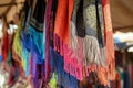 scarves with fringes swaying on a breeze in an openair market Royalty Free Stock Photo