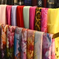 Scarves on racks in fashion store,close up Royalty Free Stock Photo