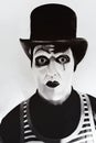 Scary angry mime wearing a tall hat