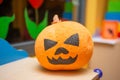 Scary artificial hand made pumpkin decoration in the kids club during Halloween