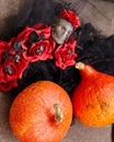 Scary background for Halloween from pumpkins and cobwebs, lace and roses. Royalty Free Stock Photo