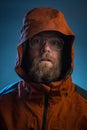 Scary bearded man in orange jacket