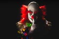 Scary clown on a dark background Royalty Free Stock Photo
