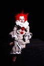 Scary clown killer on a black background. horror. Halloween concept. creepy look
