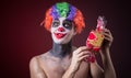 Scary clown with spooky makeup and more candy Royalty Free Stock Photo