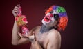 Scary clown with spooky makeup and more candy Royalty Free Stock Photo