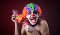 Scary clown with spooky makeup and more candy Royalty Free Stock Photo