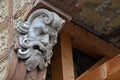 Scary decorative ancient greek head plaster placed on column eclectic styled building in Komarno, southern Slovakia