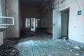 Scary empty dark corridor in an abandoned building. Shabby walls.