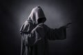 Scary figure in hooded cloak