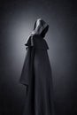 Scary figure in hooded cloak