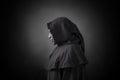 Scary figure in hooded cloak with mask Royalty Free Stock Photo