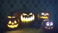 Scary funny angry big orange halloween pumpkins in fire, fog, dark, mist, dusk. Pumpkin exhales smoke, breathes color