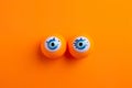 Scary and funny halloween greeting card monster eyes on orange background ai generated Royalty Free Stock Photo