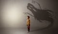 Scary ghost shadow behind kid Royalty Free Stock Photo