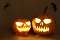 Scary glowing pumpkins faces. Scary Halloween pumpkins on a burlap background.